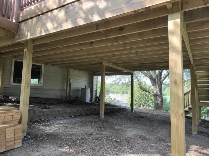 Deck support posts and framing under elevated deck in Lone Tree, Iowa.