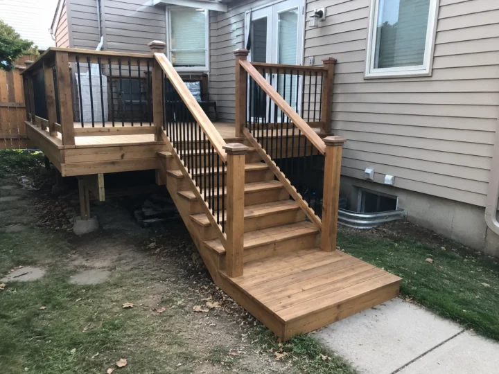 Finished small raised wood deck with stairs in North Liberty, Iowa.