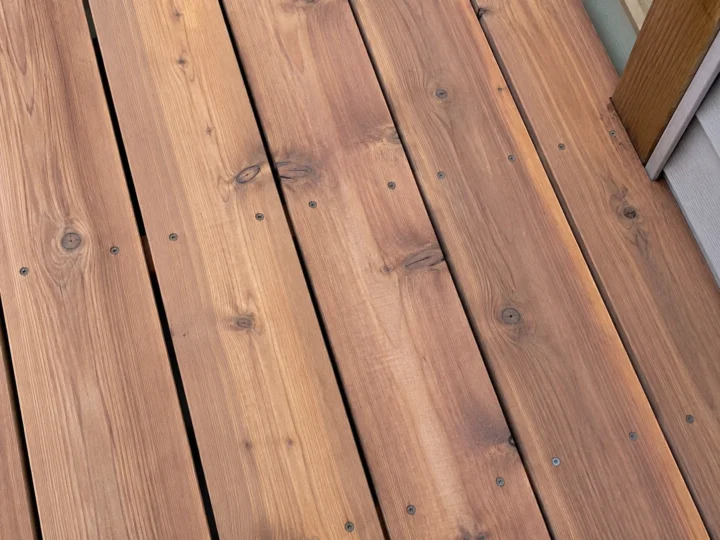 Stained wood deck board close up in Oxford, Iowa.