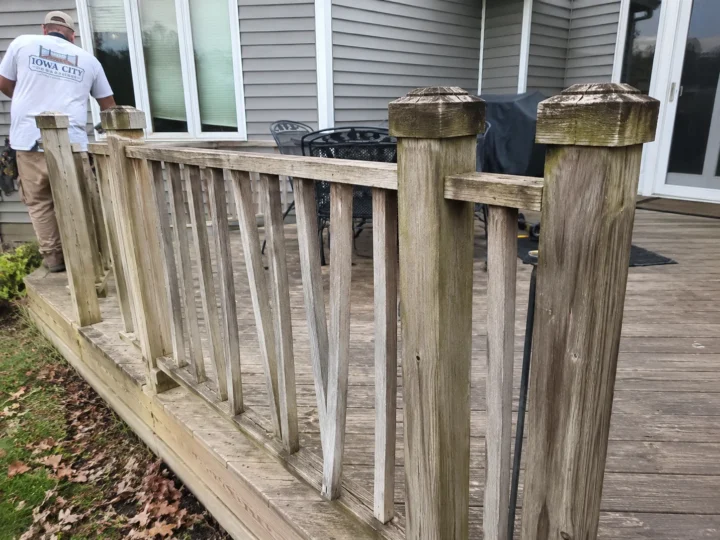 Weathered wood deck railing close up in Amana, Iowa.